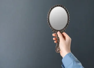 BET99: affiliate playbook in Alberta should mirror Ontario Woman holding up mirror
