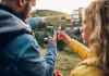 GamCare makes new appointment to navigate post-levy world People looking at a nap on a phone