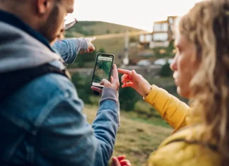 GamCare makes new appointment to navigate post-levy world People looking at a nap on a phone