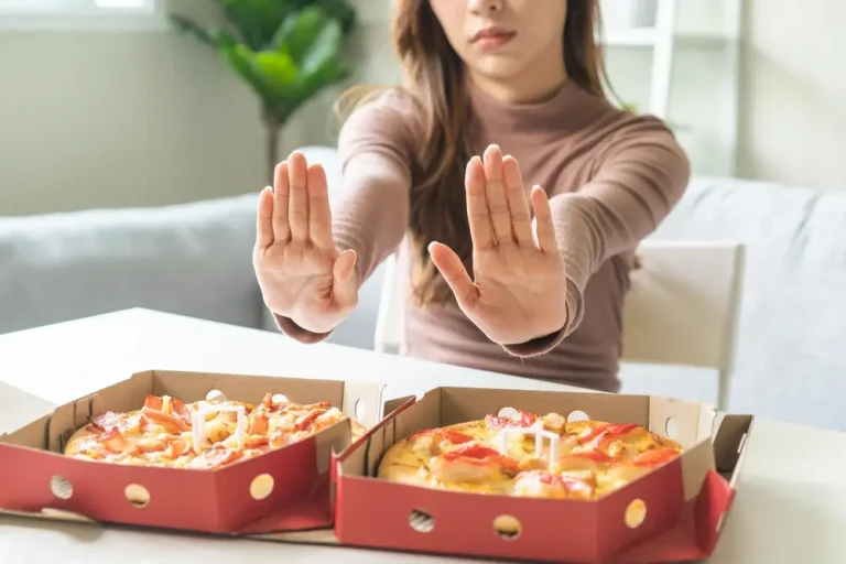 Woman pushes away food