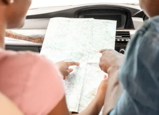 The roadmap for Veikkaus following new CFO appointment Couple looking at a map in a car