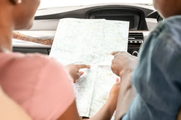 Couple looking at a map in a car