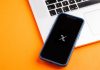 X: betting integrations, AI and building communities for brand engagement X logo displayed on a mobile phone