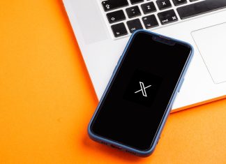 X: betting integrations, AI and building communities for brand engagement X logo displayed on a mobile phone