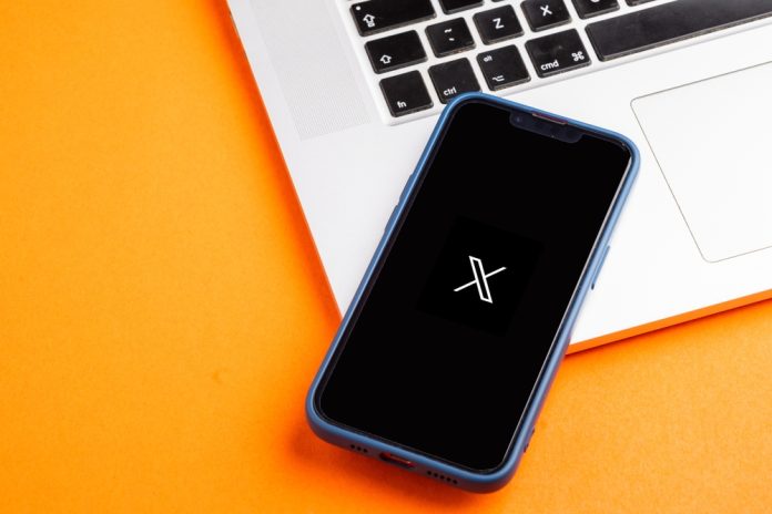 X Twitter X logo displayed on a mobile phone