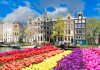 Gaming in Holland Conference 2026 to spotlight channelisation Facades of old historic Houses and trees over canal water, Amsterdam, Netherlands