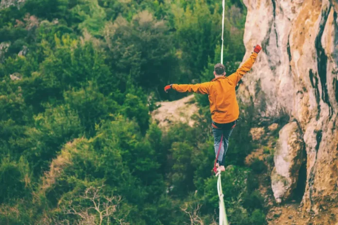 Man walks on tightrope