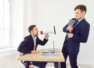 KSA reprimands Betnation for ‘highly reprehensible’ self-exclusion failures Person shouting through loudspeaker at someone else