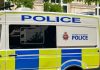 Two arrested in Manchester gambling den raid Greater Manchester Police van