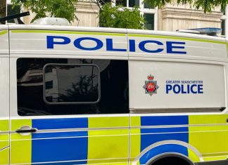 Two arrested in Manchester gambling den raid Greater Manchester Police van