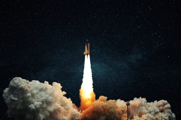 Space,Rocket,Shuttle,With,Blast,And,Puff,Of,Smoke,Lift