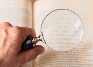 UK Government calls out Gambling Commission on FRAs clarity Magnifying glass